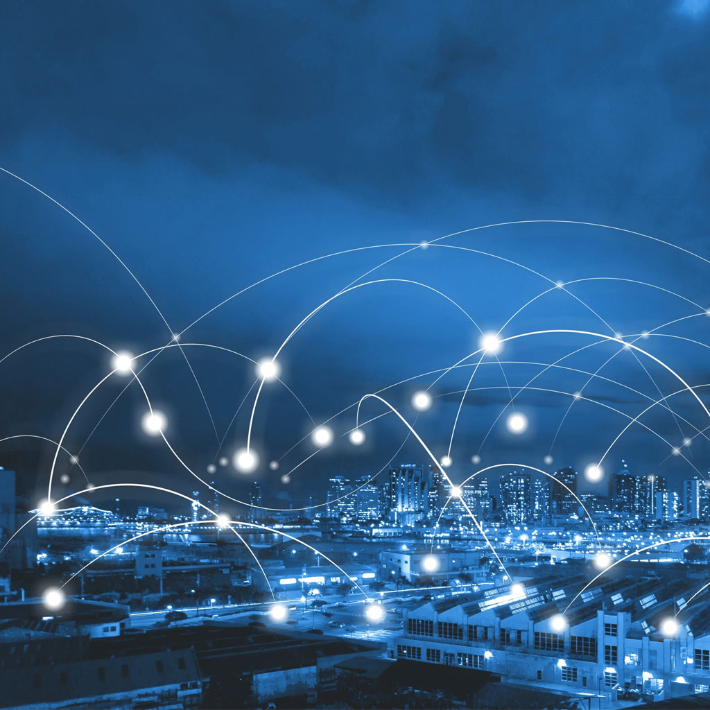 A city at night connected by glowing data lines, symbolising WideSky’s energy management and connectivity platform powered by LPA’s smart hardware.